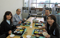 Employees enjoying meals from the TABLE FOR TWO menu