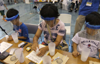 Children learning a chemist’s job