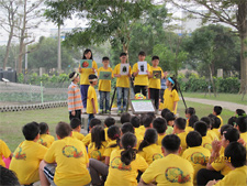 Children showing different types of beetles that inhabit the area surrounding the organic farm on the school grounds