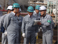 President Koshiba visiting a plant