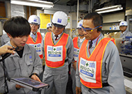 President Koshiba visiting a plant